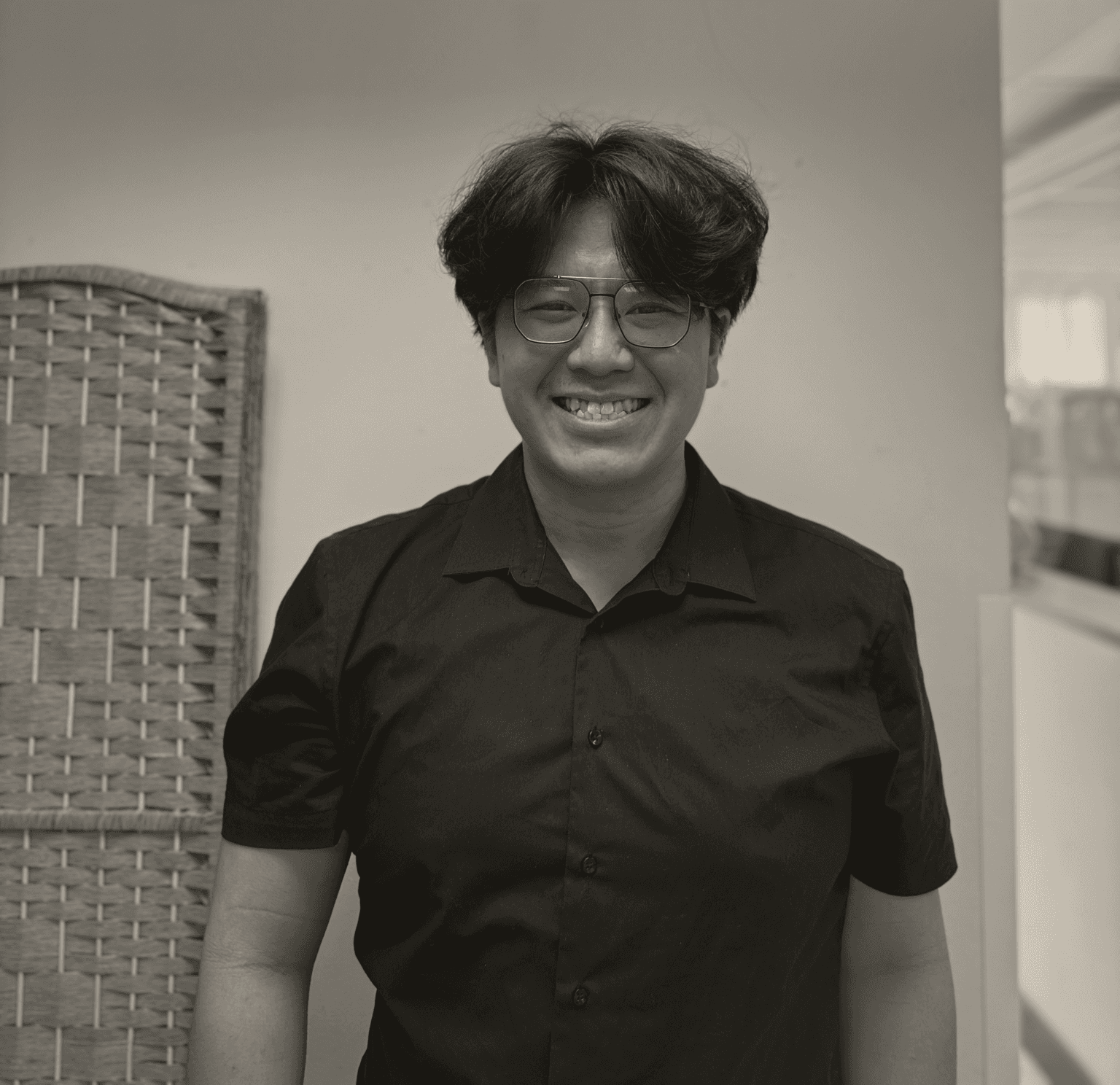 Joey Pang smiling, in a black shirt